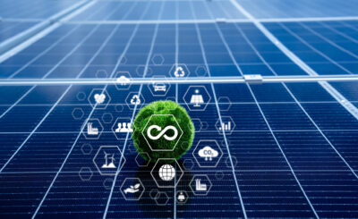 Sustainability And Renewable Energy Concept With Solar Panel Background. Green Circular Economy Symbol With Eco Friendly Icons Representing Clean Energy, Recycling, And Low Carbon Footprint.