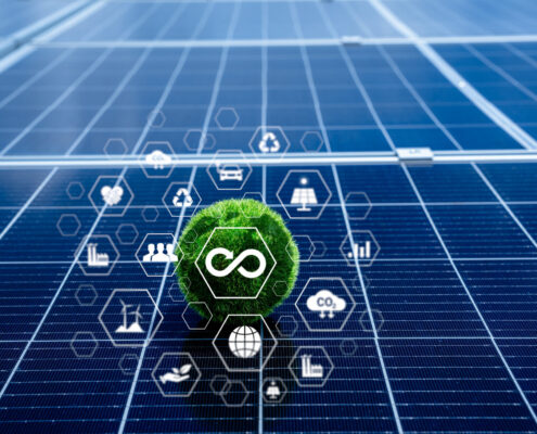 Sustainability And Renewable Energy Concept With Solar Panel Background. Green Circular Economy Symbol With Eco Friendly Icons Representing Clean Energy, Recycling, And Low Carbon Footprint.